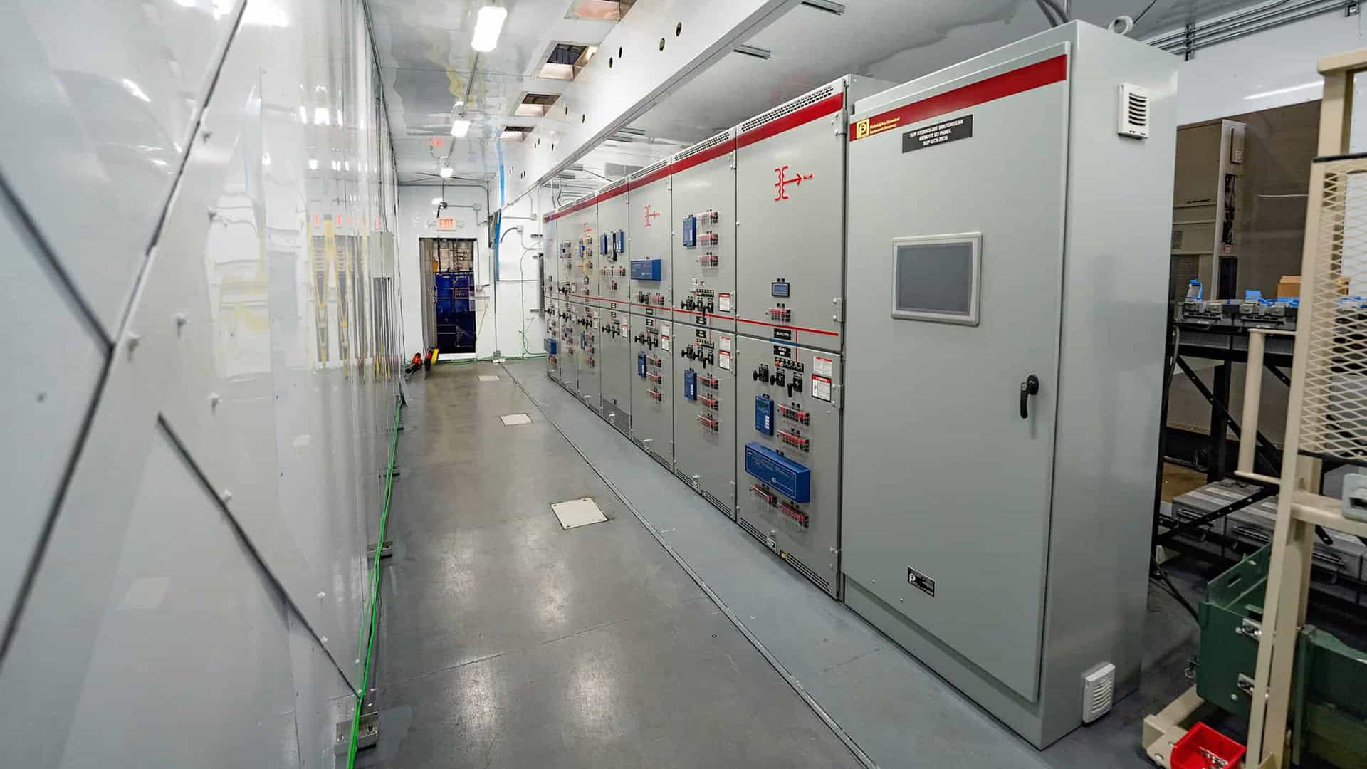Switchgear equipment inside of an enclosure built by ASC.